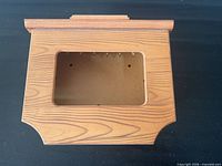 Front view of wooden key holder box with picture frame window