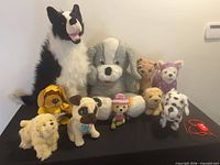 All ten plush dogs displayed together front and back rows