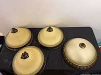 All four glass flush mounts arranged on table
