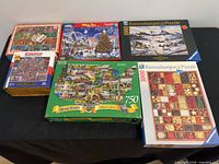 All six puzzle boxes displayed on table