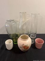 group shot of all eight vases and planters