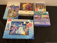 All five puzzle boxes grouped on tabletop