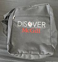 Front view showing Discover McGill logo and front zip pocket
