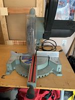Front view of King Canada mitre saw showing base, fence and blade guard