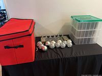 Overall lot showing red storage bag, plastic drawers and assorted ornaments