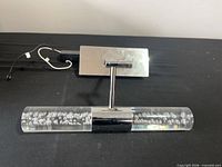 Front view showing chrome backplate, stem and acrylic light bar