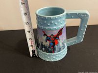 Front view showing Superman graphic and size reference