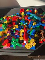Pile of multicolour large plastic bricks, slide piece visible
