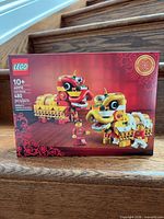 Front of sealed LEGO 40915 box showing lion dance models, age 10+ and 480 pcs