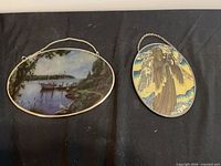 Two oval glass suncatchers side-by-side showing overall size and design