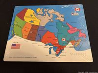 Front view of sealed Canada map wooden puzzle