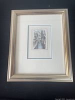 Front view of framed city canal print in silver frame