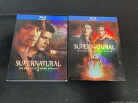 Front view of both Supernatural Season 3 and Season 5 Blu-ray slipcovers