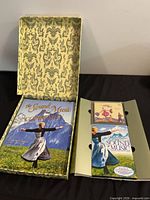 Open slipcase showing companion book and DVD/CD tray