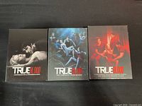 Front view of the three DVD box sets for Seasons 2-4