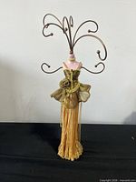 Full view of jewelry stand showing entire form and arms