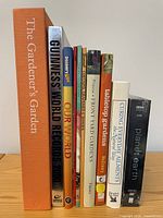 Front view of all publications standing upright showing spines and titles