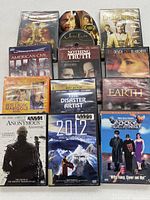 All 12 DVD cases and loose disc laid out