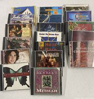 All 18 Christmas and religious CDs standing in three rows