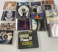 All 18 discs laid out showing front artwork and Linwood Barclay audio book box