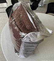 Bagged brown quilted comforters side view