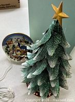 Overall view of both items: PartyLite tree and Avon village scene with cord