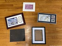 Front view of all five framed items laid out on floor
