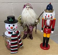 Front view showing all three Christmas characters together
