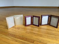 All three folding frames side by side, fully open