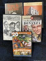 Front view of all five DVD cases showing titles