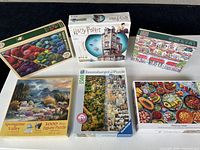 All six boxed puzzles visible on tabletop