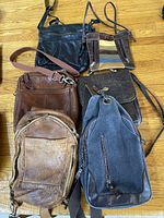 All six bags laid out showing variety of styles and colors