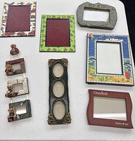 Front view of all seven frames showing designs and apertures