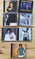 Front covers of all seven CD cases
