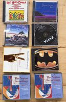 Front view of eight jewel cases showing cover art