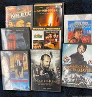 All visible DVD cases laid out on blue background