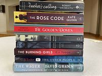 Stacked view showing spine titles and authors of all eight books