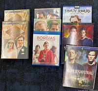 All eight TV series video cases displayed on dark surface