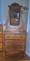 front view of dresser with attached mirror