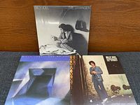 Front covers of three Billy Joel LPs, showing sealed shrink on The Stranger and sleeve condition of the others