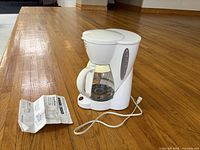 Coffee maker, carafe, power cord, instruction manual