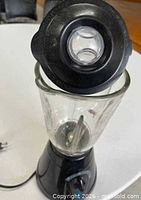 Top angle with lid removed showing blade assembly and glass jar interior