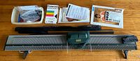 Full knitting machine with accessories laid out