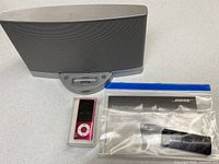 Overall lot showing Bose SoundDock Series II, iPod nano, remote and manual in bag