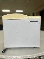 Front view of Breadman Plus bread maker showing logo and exterior condition