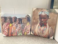 Both sealed mounted prints leaning against wall