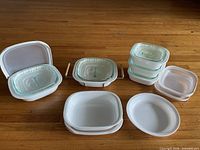 Full set of CorningWare SimplyLite dishes and lids displayed on floor