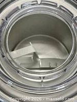 Top view into freezer bowl showing dasher and clear lid