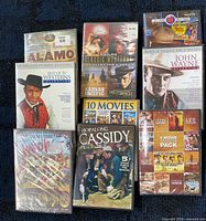 Group shot of eight Western DVDs showing all cover fronts and shrink-wrap status