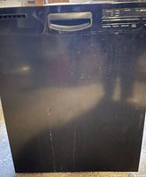 Front view showing black finish, handle, surface wear